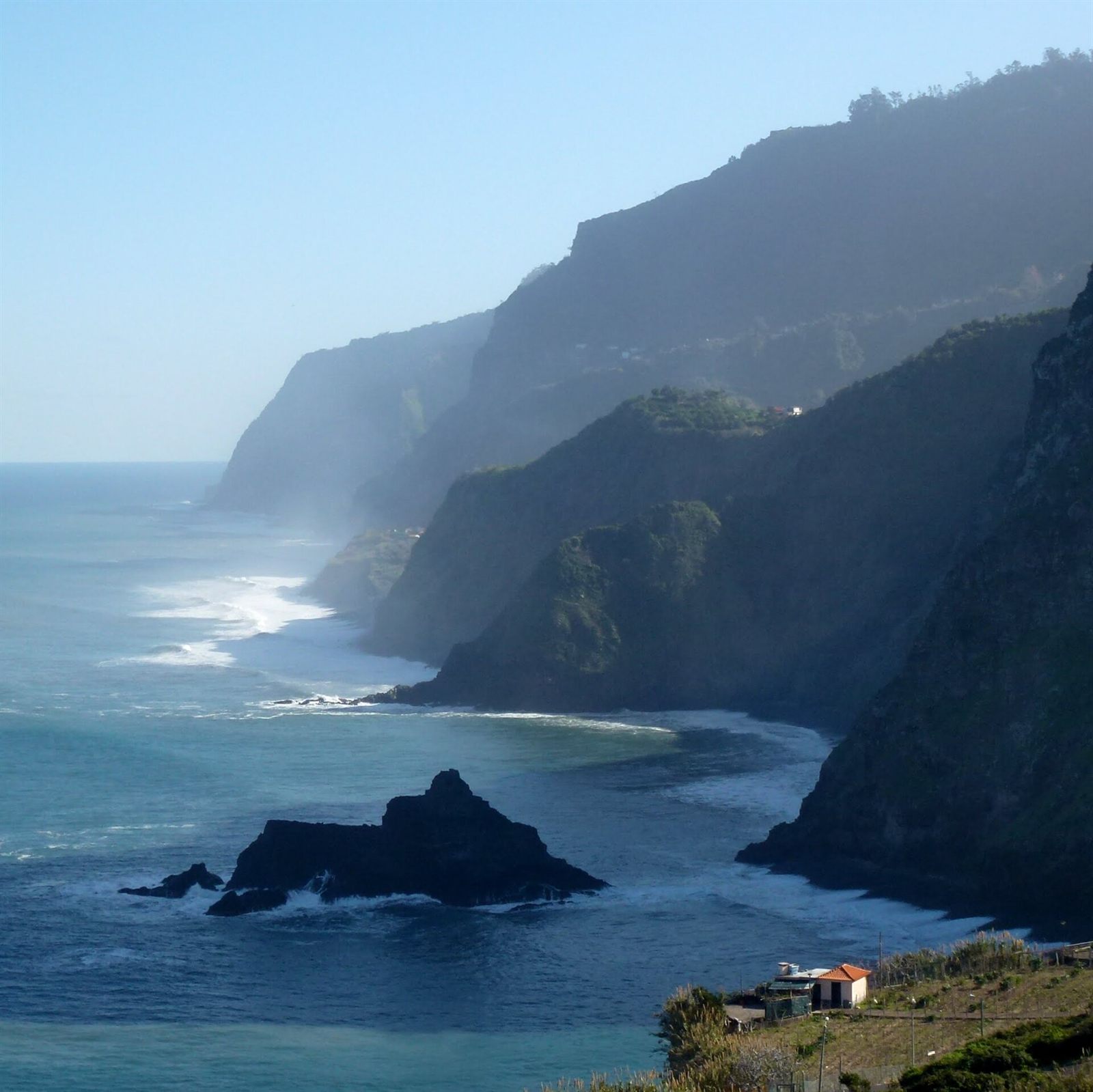Steep coastal cliffs and misty headlands along the Atlantic near Boaventura, Madeira
